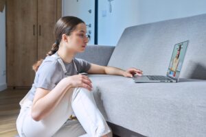 Woman with Depression attending virtual therapy session.