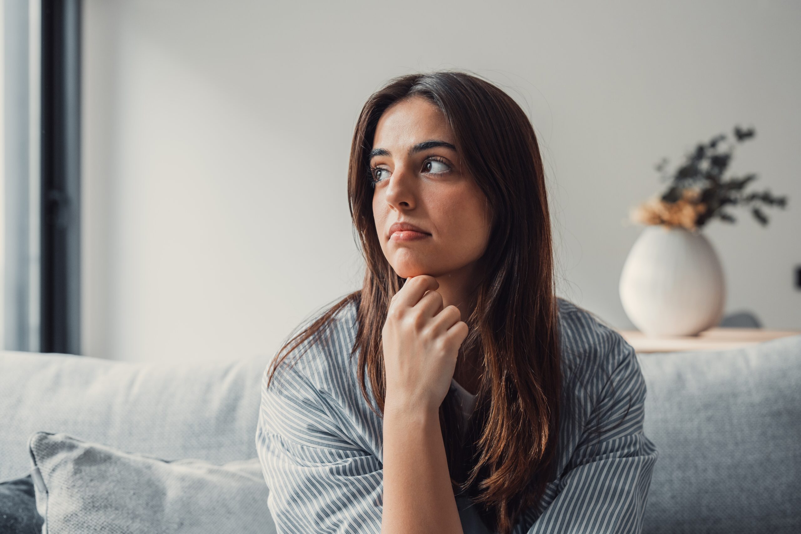 Woman with depression thinking about starting virtual therapy